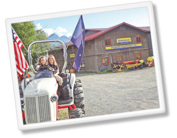girls on tractor in Alaska