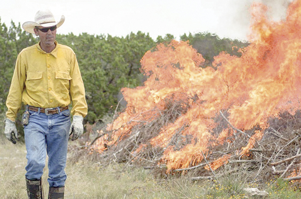 Keith Blair acts as burn boss dirung a controlled burn in Texas